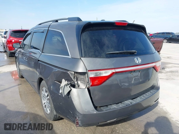 2012 Honda Odyssey EX-L with VIN 5FNRL5H60CB094682, listed as a IAAI auction lot 41570797 with 127,890 mi miles and . Bid and sale history available at carsss.com. Image 6.