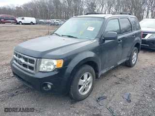 2011 Ford Escape XLT with VIN 1FMCU9D79BKB81857, listed as a IAAI auction lot 41736042 with 999,999 mi miles. Bid and sale history available at carsss.com. Image 2.