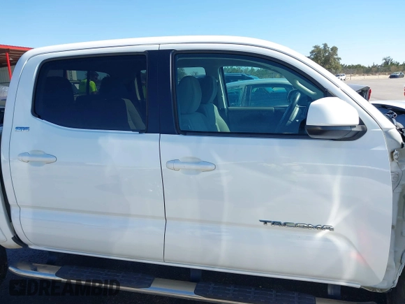2018 Toyota Tacoma SR5 with VIN 5TFAZ5CN4JX056465, listed as a IAAI auction lot 41767848 with 71,532 mi miles and . Bid and sale history available at DreamBid. Image 14.