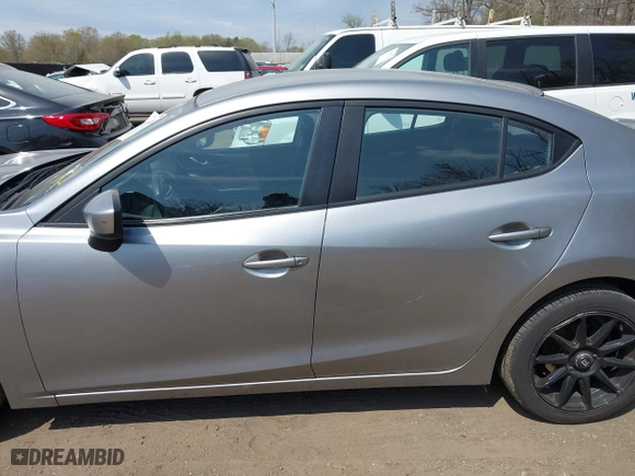 2016 Mazda Mazda3 i Sport with VIN JM1BM1T71G1335980, listed as a IAAI auction lot 42003186 with 131,015 mi miles. Bid and sale history available at carsss.com. Image 14.