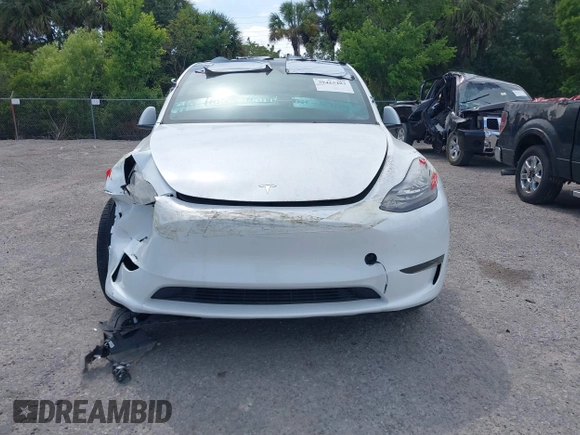2023 Tesla Model Y Long Range with VIN 7SAYGDEE3PA206757, listed as a IAAI auction lot 39425483 with 5,711 mi miles and . Bid and sale history available at DreamBid. Image 12.