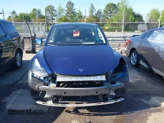 2023 Tesla Model Y Long Range with VIN 7SAYGDEE0PF762592, listed as a IAAI auction lot 41983933 with 28,510 mi miles and . Bid and sale history available at carsss.com. Image 12.
