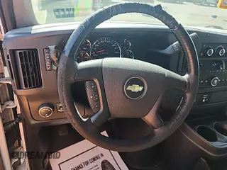 2014 Chevrolet Express Cargo with VIN 1GCWGFCG4E1148722, listed as a IAAI auction lot 42843884 with 188,945 mi miles and . Bid and sale history available at DreamBid. Image 3.