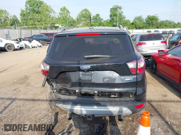 2018 Ford Escape Titanium with VIN 1FMCU9J95JUB30803, listed as a IAAI auction lot 42286536 with 63,309 mi miles and . Bid and sale history available at DreamBid. Image 17.