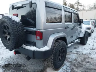 2015 Jeep Wrangler Unlimited Rubicon Hard Rock with VIN 1C4HJWFG1FL659803, listed as a IAAI auction lot 41172485 with 126,881 mi miles and . Bid and sale history available at DreamBid. Image 4.