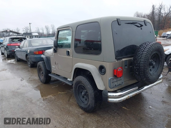 2006 Jeep Wrangler Sport Right Hand Drive with VIN 1J4F449S06P725862, listed as a IAAI auction lot 41562989 with 121,997 mi miles. Bid and sale history available at carsss.com. Image 3.