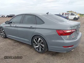 2021 Volkswagen Jetta GLI S with VIN 3VW6T7BU8MM011418, listed as a IAAI auction lot 40474082 with 76,619 mi miles and . Bid and sale history available at DreamBid. Image 3.