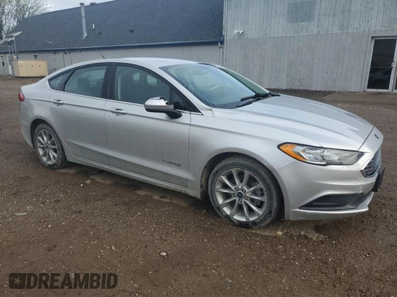 2017 Ford Fusion Hybrid SE z VIN 3FA6P0LU4HR384645, wystawiony jako Copart lot #56454995 z przebiegiem 165 322 mil mil oraz Czysty tytuł • Clean title. Historia ofert i sprzedaży dostępna na DreamBid. Obrazek 4.