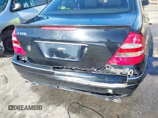 2003 Mercedes-Benz E-Class 3.2L with VIN WDBUF65J93X110625, listed as a IAAI auction lot 41485310 with 164,165 mi miles. Bid and sale history available at carsss.com. Image 6.