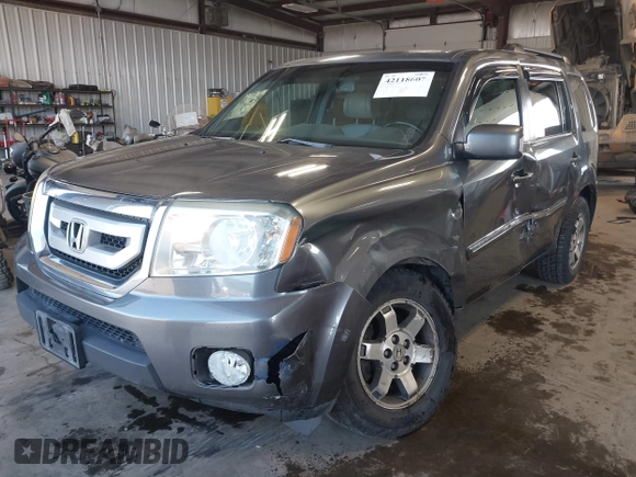 2010 Honda Pilot Touring with VIN 5FNYF4H89AB026005, listed as a IAAI auction lot 42118607 with 182,689 mi miles. Bid and sale history available at carsss.com. Image 17.