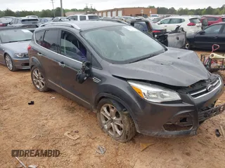 2015 Ford Escape Titanium with VIN 1FMCU9J90FUC14650, listed as a IAAI auction lot 41992858 with 158,963 mi miles and . Bid and sale history available at DreamBid. Image 1.