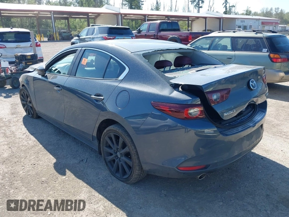 2023 Mazda 3 S Carbon Edition with VIN 3MZBPACM5PM376545, listed as a IAAI auction lot 42404054 with Not provided miles and . Bid and sale history available at DreamBid. Image 3.