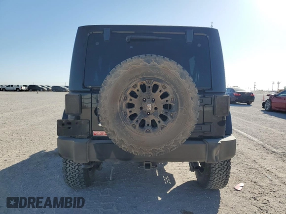 2012 Jeep Wrangler Unlimited Rubicon z VIN 1C4HJWFG9CL105047, wystawiony jako Copart lot #49494005 z przebiegiem 132 591 mil mil oraz Szkoda całkowita • Salvage title. Historia ofert i sprzedaży dostępna na DreamBid. Obrazek 6.