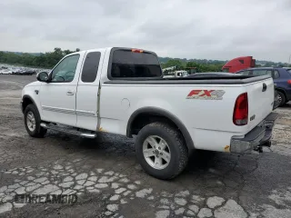 2003 Ford F-150 XL with VIN 1FTRX18L33NA43522, listed as a Copart auction lot 61197615 with 101,061 mi miles and Salvage title. Bid and sale history available at DreamBid. Image 2.