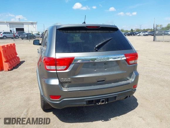 2011 Jeep Grand Cherokee Laredo with VIN 1J4RR4GGXBC587911, listed as a IAAI auction lot 42156885 with 178,999 mi miles and . Bid and sale history available at DreamBid. Image 16.