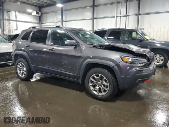 2020 Jeep Cherokee Trailhawk with VIN 1C4PJMBX9LD582951, listed as a Copart auction lot 60152935 with 61,448 mi miles and Salvage title. Bid and sale history available at DreamBid. Image 4.