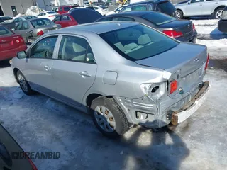 2010 Toyota Corolla with VIN JTDBU4EE3A9098933, listed as a IAAI auction lot 41643811 with 69,806 mi miles. Bid and sale history available at carsss.com. Image 3.