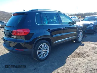 2014 Volkswagen Tiguan S z VIN WVGBV3AX4EW581302, wystawiony jako IAAI lot #41033175 z przebiegiem 69 791 mil mil oraz . Historia ofert i sprzedaży dostępna na DreamBid. Obrazek 4.