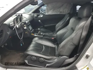 2004 Nissan 350Z Touring z VIN JN1AZ34E84T063971, wystawiony jako Copart lot #57267825 z przebiegiem 131 036 mil mil oraz Szkoda całkowita • Salvage title. Historia ofert i sprzedaży dostępna na DreamBid. Obrazek 7.
