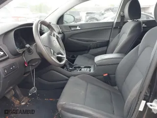 2019 Hyundai Tucson SE with VIN KM8J23A40KU874423, listed as a IAAI auction lot 41858253 with 136,651 mi miles. Bid and sale history available at carsss.com. Image 5.
