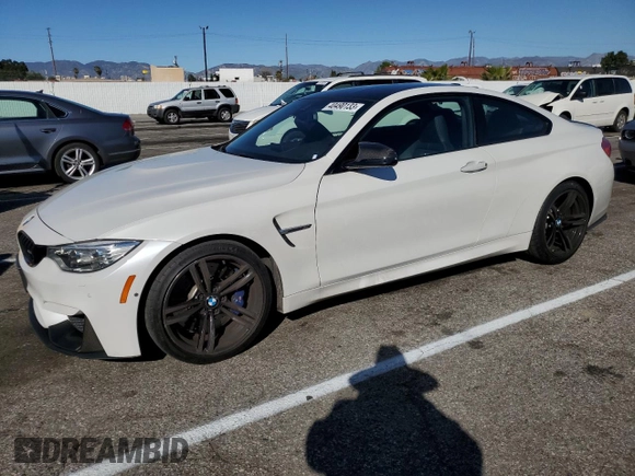 2015 BMW M4 with VIN WBS3R9C55FK330561, listed as a Copart auction lot 40490133 with 65,127 mi miles. Bid and sale history available at carsss.com. Image 1.