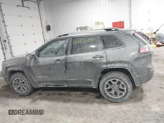 2021 Jeep Cherokee Trailhawk z VIN 1C4PJMBX4MD148597, wystawiony jako IAAI lot #41622099 z przebiegiem 48 452 mil mil oraz . Historia ofert i sprzedaży dostępna na DreamBid. Obrazek 14.