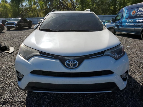 2016 Toyota RAV4 Hybrid XLE with VIN JTMRJREV6GD056931, listed as a Copart auction lot 49327875 with 145,824 mi miles and Salvage Title. Bid and sale history available at carsss.com. Image 5.