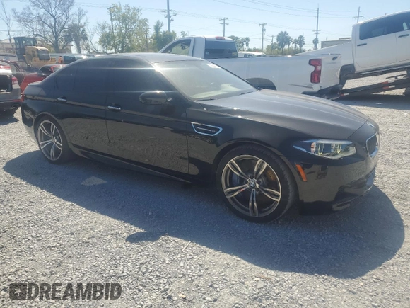 2014 BMW M5 z VIN WBSFV9C52ED593005, wystawiony jako Copart lot #49054395 z przebiegiem 71 213 mil mil oraz Szkoda całkowita • Salvage title. Historia ofert i sprzedaży dostępna na DreamBid. Obrazek 4.