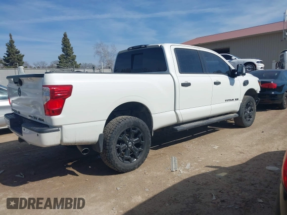 2018 Nissan Titan XD SV with VIN 1N6BA1F40JN523851, listed as a IAAI auction lot 41800730 with 104,527 mi miles. Bid and sale history available at carsss.com. Image 4.