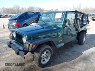 2001 Jeep Wrangler Sport with VIN 1J4FA49S31P317597, listed as a IAAI auction lot 41839524 with 145,164 mi miles. Bid and sale history available at carsss.com. Image 2.