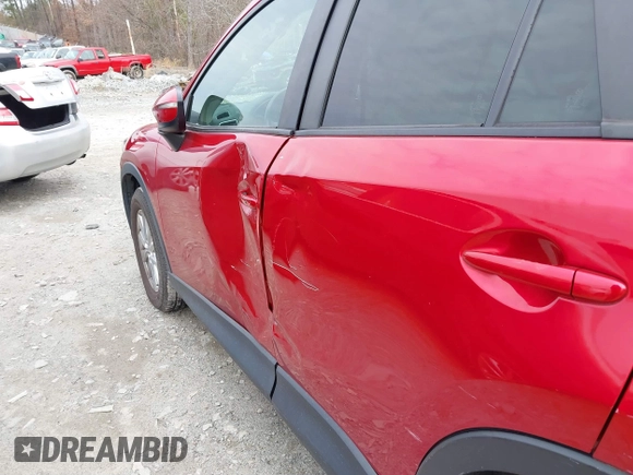 2016 Mazda CX-5 Touring z VIN JM3KE2CY3G0894441, wystawiony jako IAAI lot #41508767 z przebiegiem 88 554 mil mil oraz . Historia ofert i sprzedaży dostępna na DreamBid. Obrazek 17.