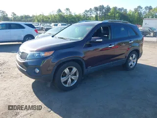 2012 Kia Sorento EX with VIN 5XYKUDA23CG206609, listed as a IAAI auction lot 42142072 with 162,574 mi miles. Bid and sale history available at carsss.com. Image 2.