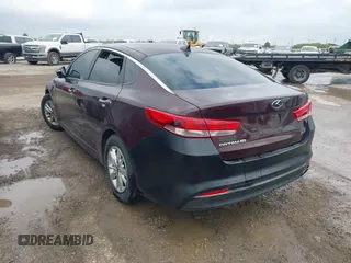 2016 Kia Optima LX with VIN 5XXGT4L3XGG027430, listed as a IAAI auction lot 41940146 with 75,456 mi miles and . Bid and sale history available at carsss.com. Image 3.