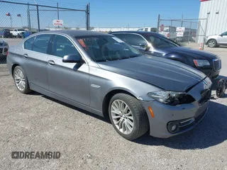 2015 BMW 5 Series 528i with VIN WBA5A5C5XFD518560, listed as a IAAI auction lot 41844445 with 164,318 mi miles. Bid and sale history available at carsss.com. Image 1.
