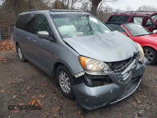 2009 Honda Odyssey EX-L with VIN 5FNRL38759B014833, listed as a IAAI auction lot 41165160 with 149,532 mi miles. Bid and sale history available at carsss.com. Image 1.