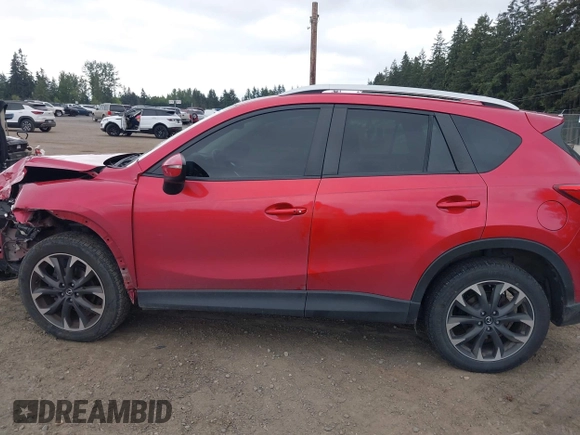 2016 Mazda CX-5 Grand Touring z VIN JM3KE4DY7G0687318, wystawiony jako IAAI lot #42228585 z przebiegiem 188 793 mil mil oraz . Historia ofert i sprzedaży dostępna na DreamBid. Obrazek 14.
