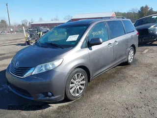 2014 Toyota Sienna Ltd with VIN 5TDDK3DC4ES083230, listed as a IAAI auction lot 41751843 with 184,501 mi miles. Bid and sale history available at carsss.com. Image 2.
