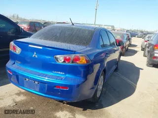 2015 Mitsubishi Lancer ES with VIN JA32U2FU0FU012412, listed as a IAAI auction lot 41766999 with 158,851 mi miles. Bid and sale history available at carsss.com. Image 4.