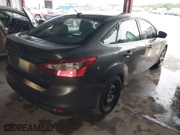 2013 Ford Focus Titanium with VIN 1FADP3J20DL189239, listed as a IAAI auction lot 42122324 with 116,917 mi miles and . Bid and sale history available at carsss.com. Image 4.