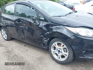 2014 Ford Fiesta SE z VIN 3FADP4EJ3EM205098, wystawiony jako IAAI lot #42371316 z przebiegiem 130 420 mil mil oraz . Historia ofert i sprzedaży dostępna na DreamBid. Obrazek 6.