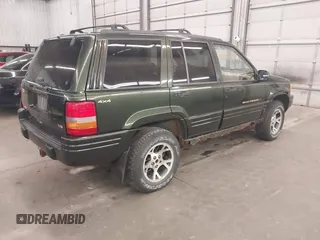 1997 Jeep Grand Cherokee Limited with VIN 1J4GZ78Y0VC684023, listed as a IAAI auction lot 42090436 with 310,831 mi miles. Bid and sale history available at carsss.com. Image 4.