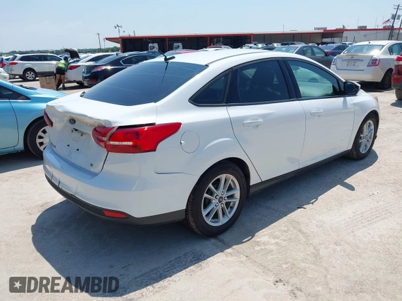 2017 Ford Focus SE with VIN 1FADP3F28HL307889, listed as a IAAI auction lot 42414711 with 169,579 mi miles and . Bid and sale history available at DreamBid. Image 4.