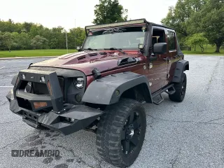 2007 Jeep Wrangler Unlimited X with VIN 1J8GA39147L156911, listed as a Copart auction lot 65987405 with 115,766 mi miles and Clean title. Bid and sale history available at DreamBid. Image 2.