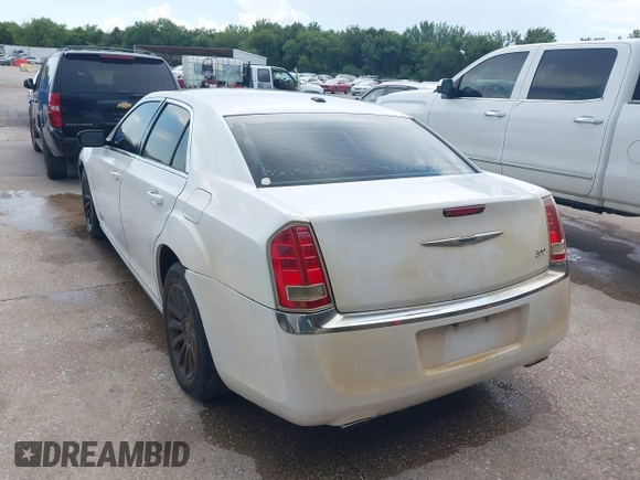 2013 Chrysler 300 with VIN 2C3CCAAG9DH588198, listed as a IAAI auction lot 42556294 with 171,765 mi miles and . Bid and sale history available at DreamBid. Image 3.