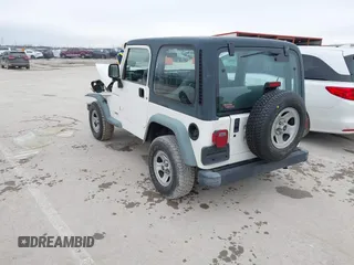 1998 Jeep Wrangler SE with VIN 1J4FY29P9WP793260, listed as a IAAI auction lot 41596990 with 90,766 mi miles. Bid and sale history available at carsss.com. Image 3.