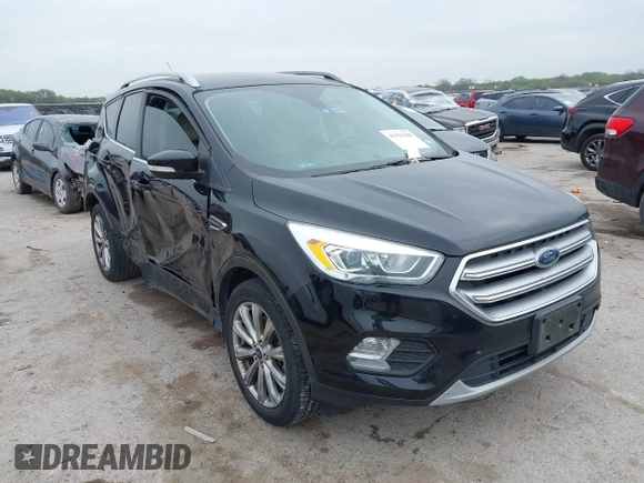 2017 Ford Escape Titanium with VIN 1FMCU0J93HUF10664, listed as a IAAI auction lot 41921588 with 88,377 mi miles. Bid and sale history available at carsss.com. Image 1.