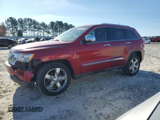 2011 Jeep Grand Cherokee Overland with VIN 1J4RS6GG7BC665979, listed as a Copart auction lot 83394214 with 216,988 mi miles and Salvage Title. Bid and sale history available at DreamBid. Image 1.