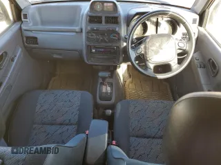 1996 Mitsubishi Montero z VIN H56A0209464, wystawiony jako Copart lot #76590414 z przebiegiem 112 578 mil mil oraz Szkoda całkowita • Salvage title. Historia ofert i sprzedaży dostępna na DreamBid. Obrazek 8.