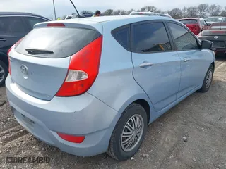 2014 Hyundai Accent GS with VIN KMHCT5AE1EU147015, listed as a IAAI auction lot 41659497 with 147,832 mi miles. Bid and sale history available at carsss.com. Image 4.
