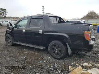 2006 Honda Ridgeline RTL with VIN 2HJYK16556H516831, listed as a Copart auction lot 52896565 with 211,504 mi miles and Salvage Title. Bid and sale history available at carsss.com. Image 2.